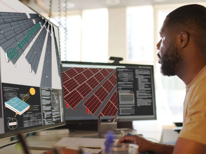 CAD solar energy Close up stock image of an African American man working at a computer screen. He’s working on CAD software looking at the design of a solar panel array in CAD with data.